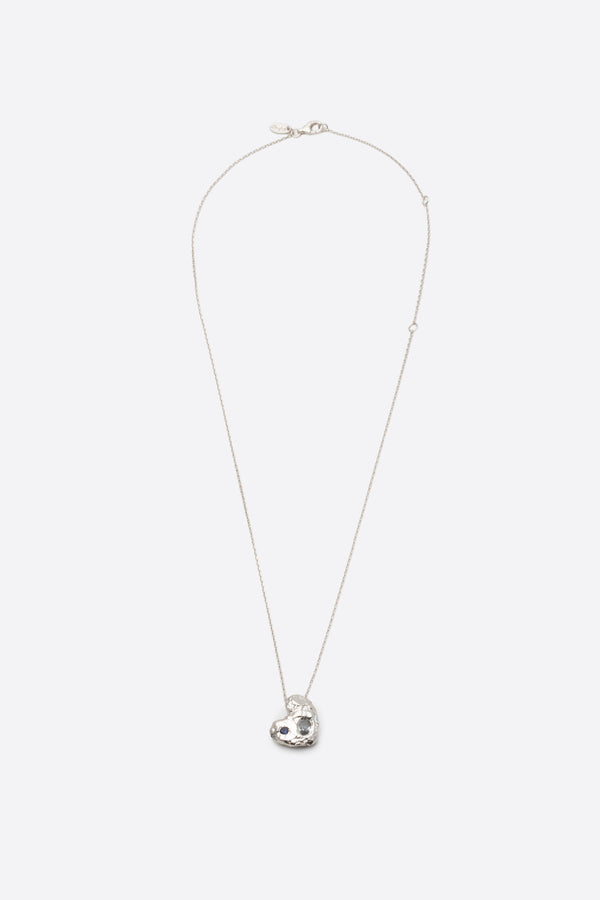 silver textured solid heart pendant necklace with two stones flat lay